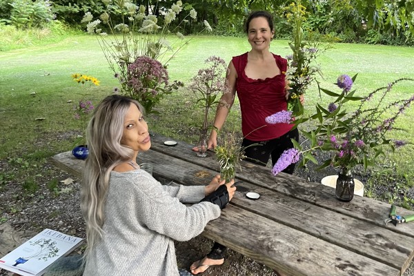 Sandra Foster (left) and Holistic Health Community's Soil to Soul Program Director Diana Seiler (right) at a wildflower arranging workshop