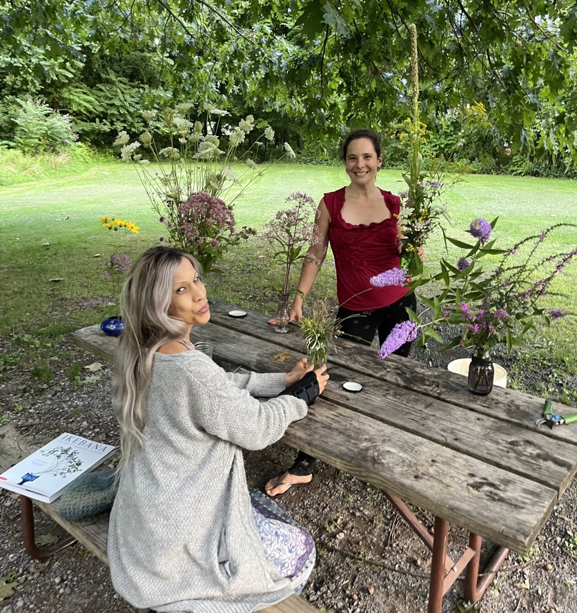 Sandra Foster (left) and Holistic Health Community's Soil to Soul Program Director Diana Seiler (right) at a wildflower arranging workshop