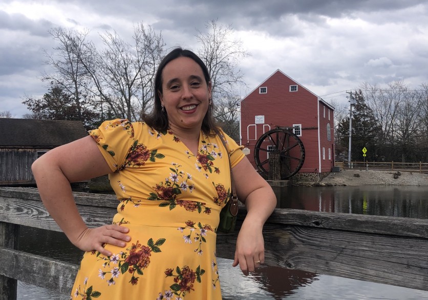 Sheila in front of a red barn