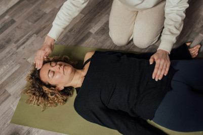 A client participates in a Reiki healing session